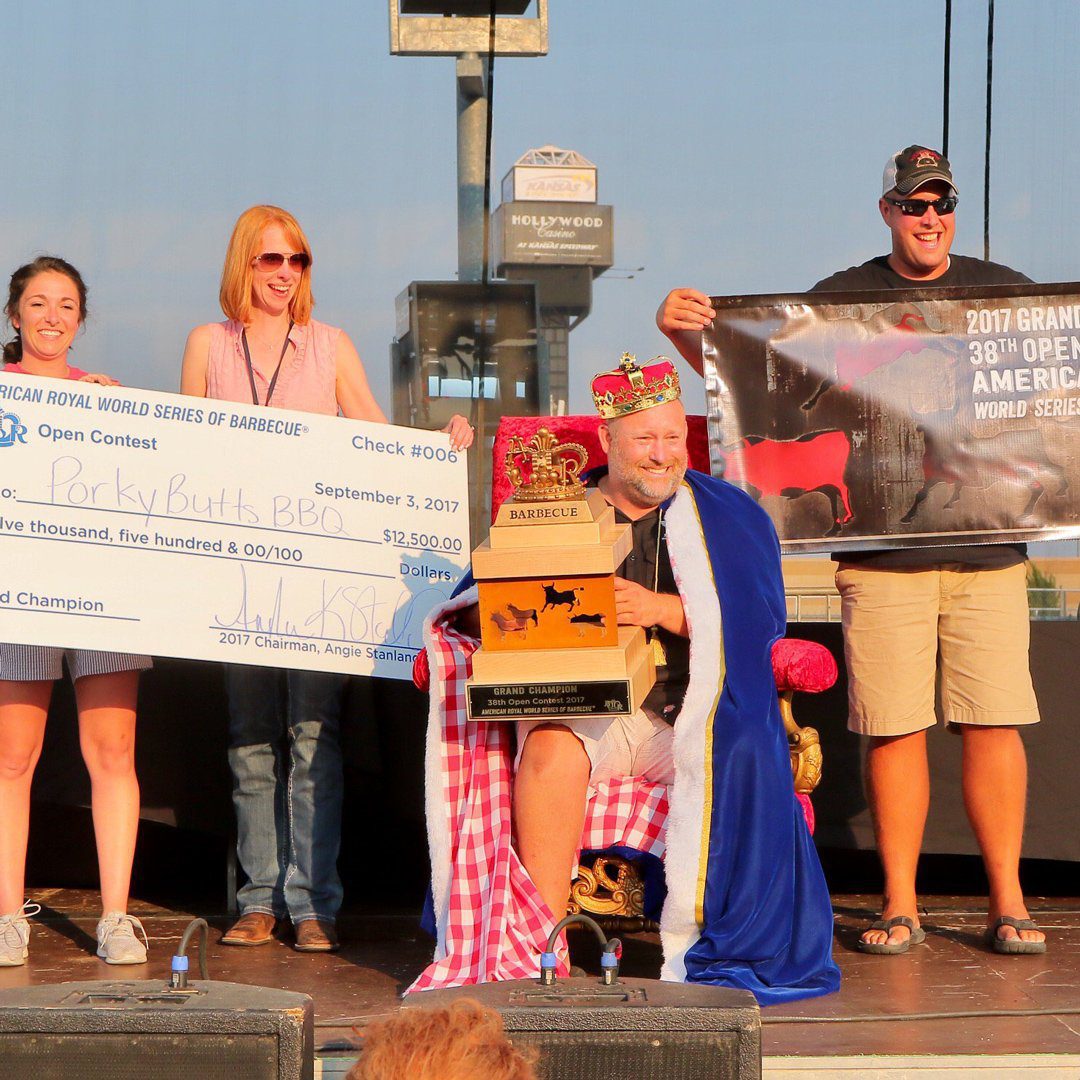 blane of porky butts bbq accepts check for american royal world series of bbq