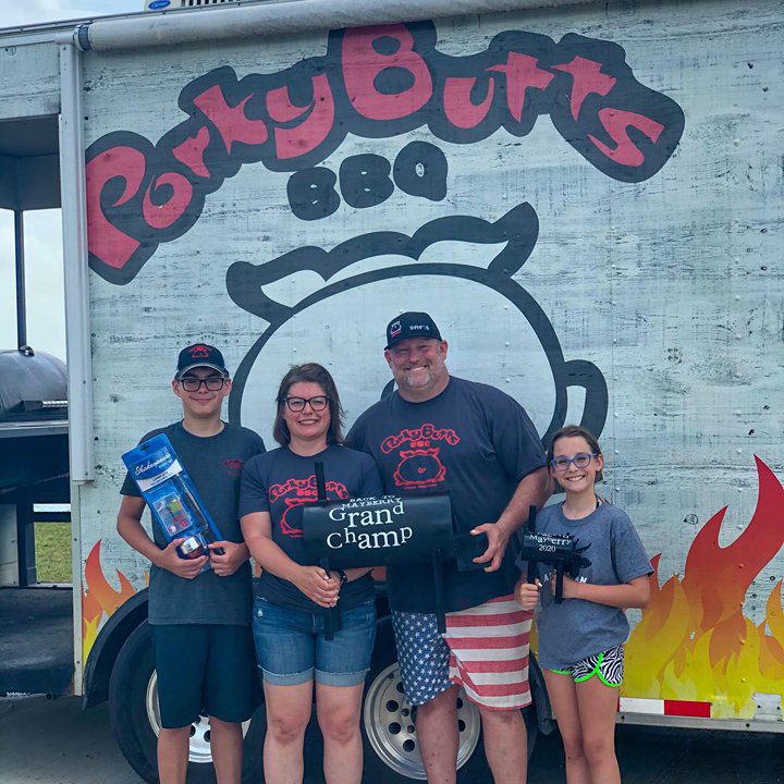 blane and his family accepting a grand champ bbq award